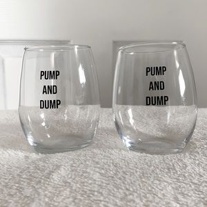 2 Stemless wine glasses that say “PUMP AND DUMP”